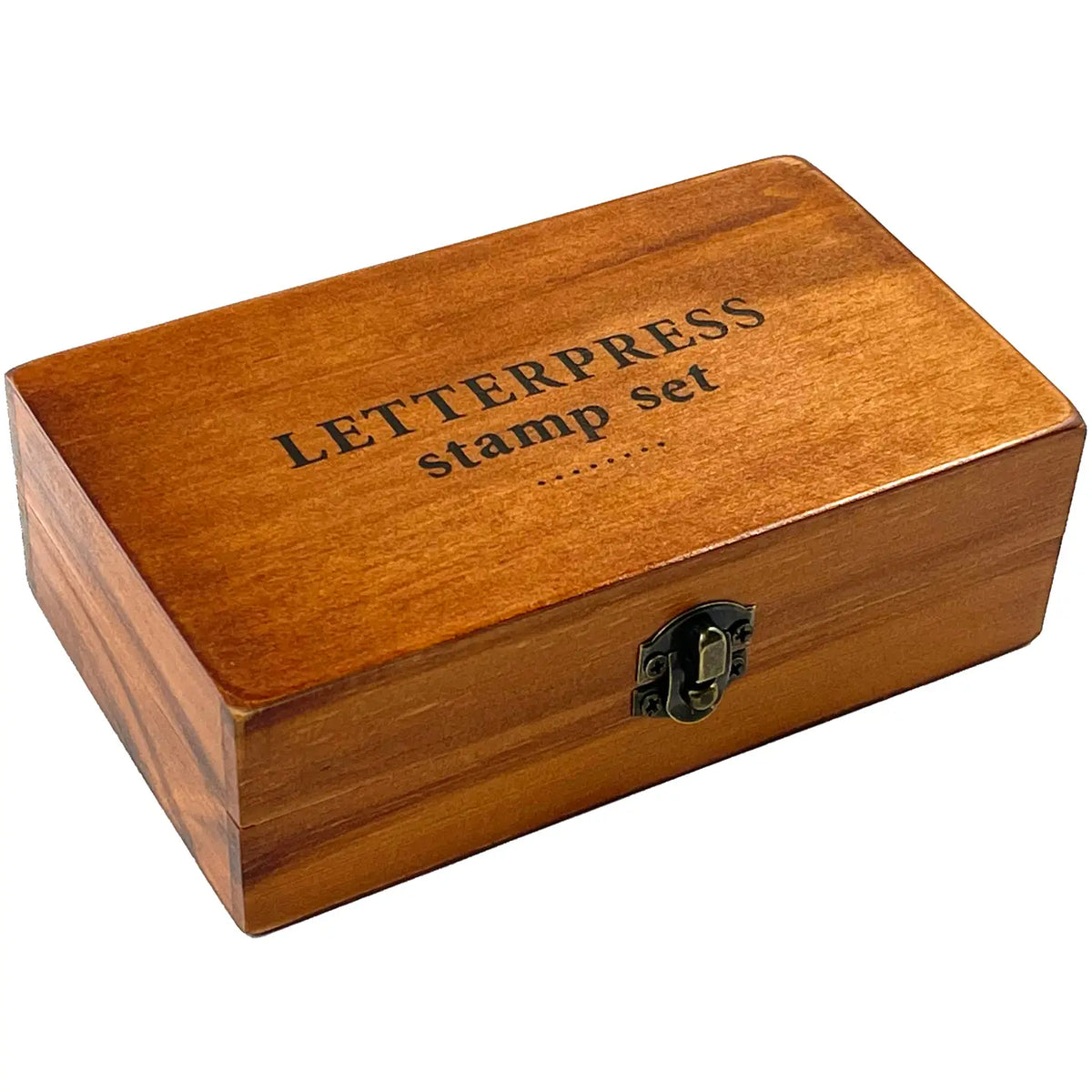 Wooden box with words 'Letterpress stamp set' on a white background