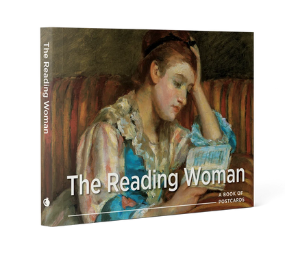 Front cover of a book of postcards with the words "The Reading Woman" featuring a painting of a dark haired women in a pink and blue gown seated on a striped couch reading a book