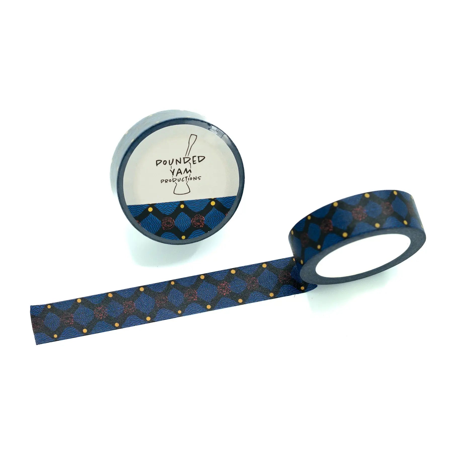 A roll of patterned washi tape with a dark blue background, featuring a geometric x design in navy and gold with small gold dots on a white background. 