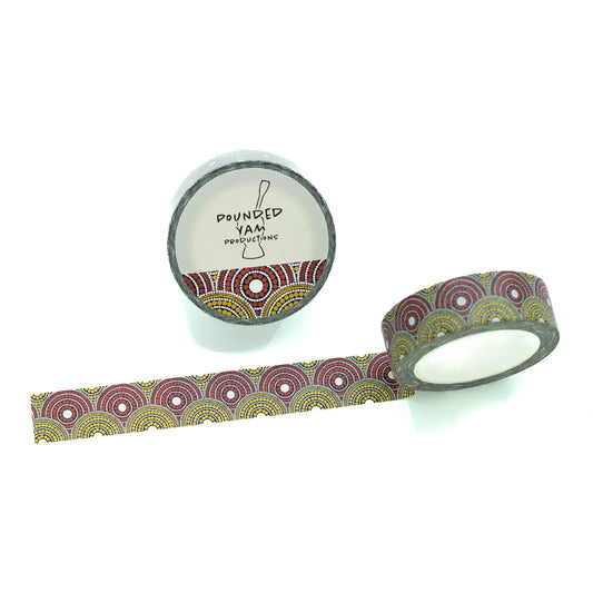 A roll of patterned washi tape with a matching unrolled strip, featuring a circular geometric design in purple, red, yellow, and green on a white background. The spool label reads 'POUNDED YAM Productions
'.