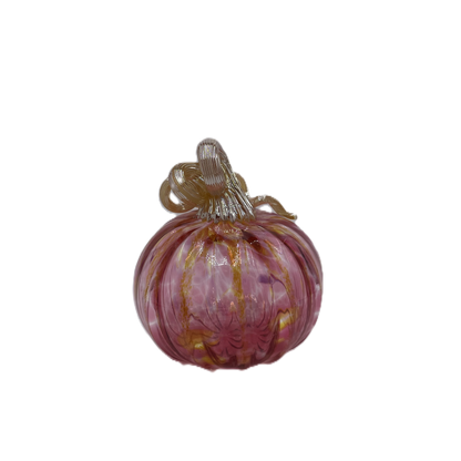 A hand-blown glass pumpkin with a pink body, accented by gold veins and a gold stem, isolated on a white background.