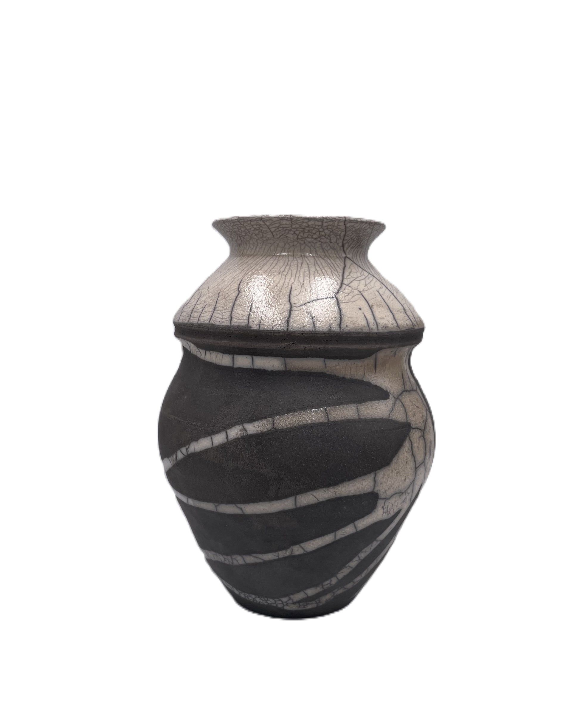Decorative ceramic vessel with black and cream raku design on a white background