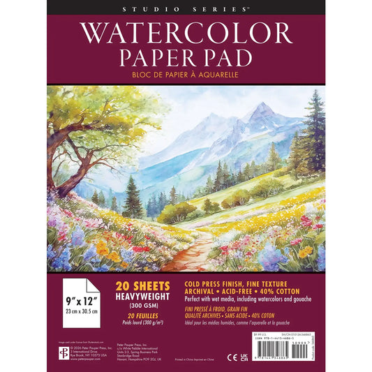 Studio Series Watercolor Paper Pad packaging showing a colorful landscape painting on the front, with text indicating 20 sheets, 9 x 12 inches, and cold press finish.