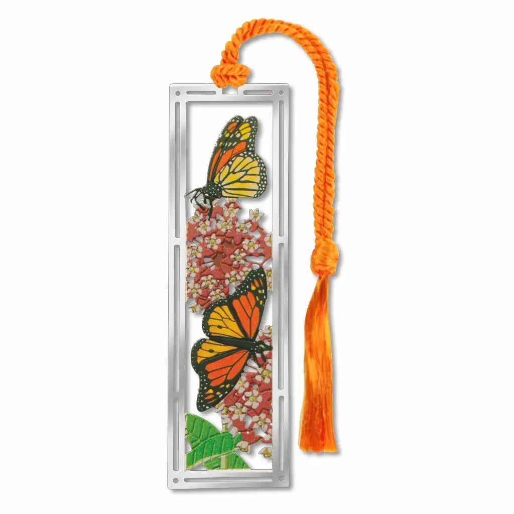 Silver metal bookmark with orange butterfly design and orange tassel on a white background