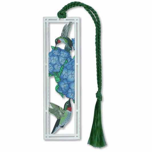 Silver metal bookmark with a red-throated hummingbird and blue flower design with a green tassel on a white background